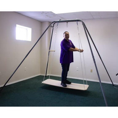 Man on Take a Swing Adult Glider Therapeutic Swing Seat in side view