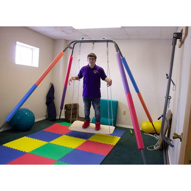Take a Swing Glider Jr Therapeutic Swing Seat full view with person
