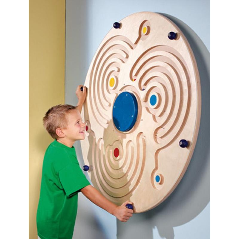 Child playing with the Haba Pro Labyrinth Wall Game