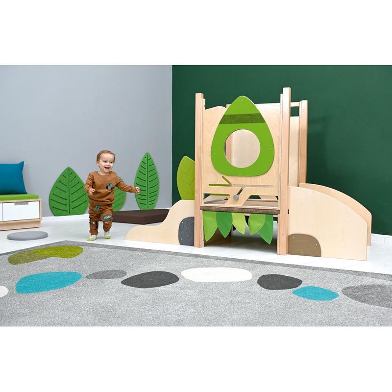 Child playing in a playroom with a Moje Bambino Flora Mini Loft