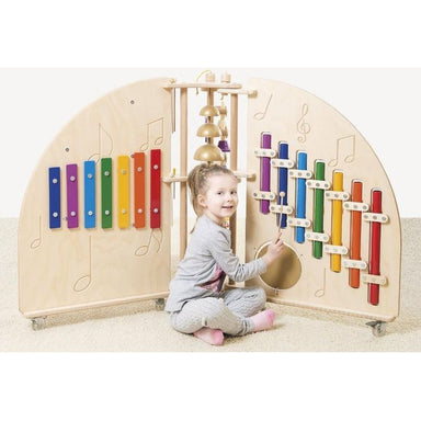 Child playing with Playscapes NOVUM Mini Music Island on a white background
