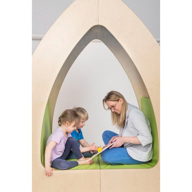 Woman and two children sitting inside the Playscapes NOVUM Reading Unit Oasis
