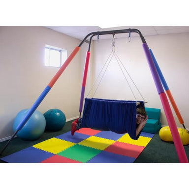 Child in a Take a Swing Jr Soft Taco Therapeutic Swing Seat