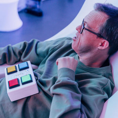 man lying down with TFH 4 Button Wireless Color Controller