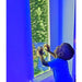 child in front of TFH Bubble Wall 60" with green lighting