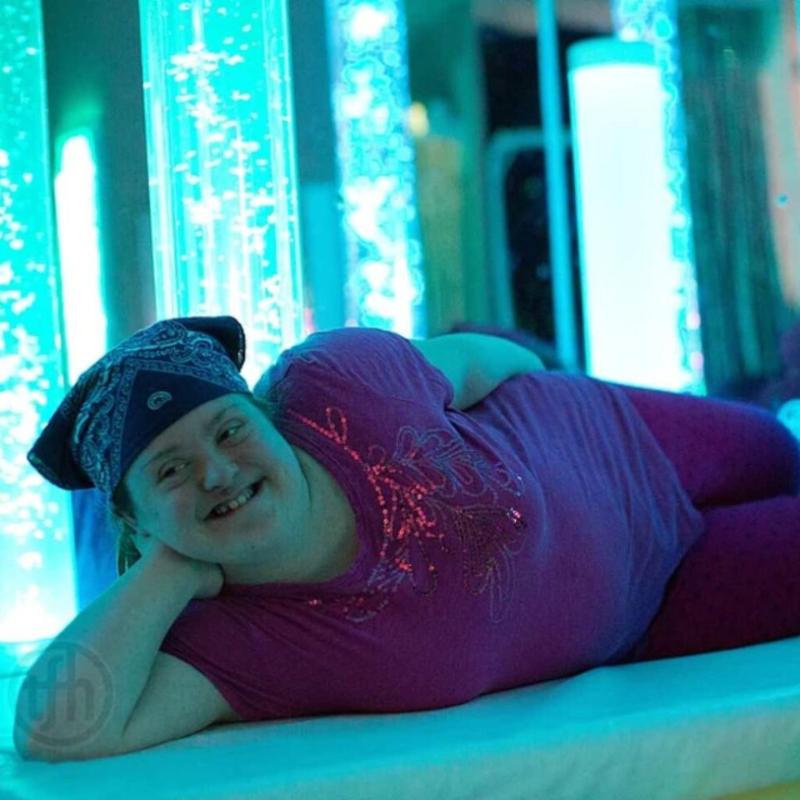 girl in front of TFH Calming Bubble Tubes