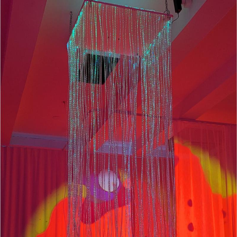 TFH Fiber Optic Waterfall with red and yellow lighting in sensory room