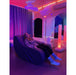 woman in sensory chair in a room with TFH Genie Color Wash Kits