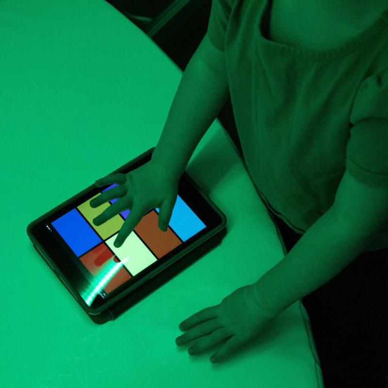 child playing with the color controller for the TFH Genie Hurricane Tubes
