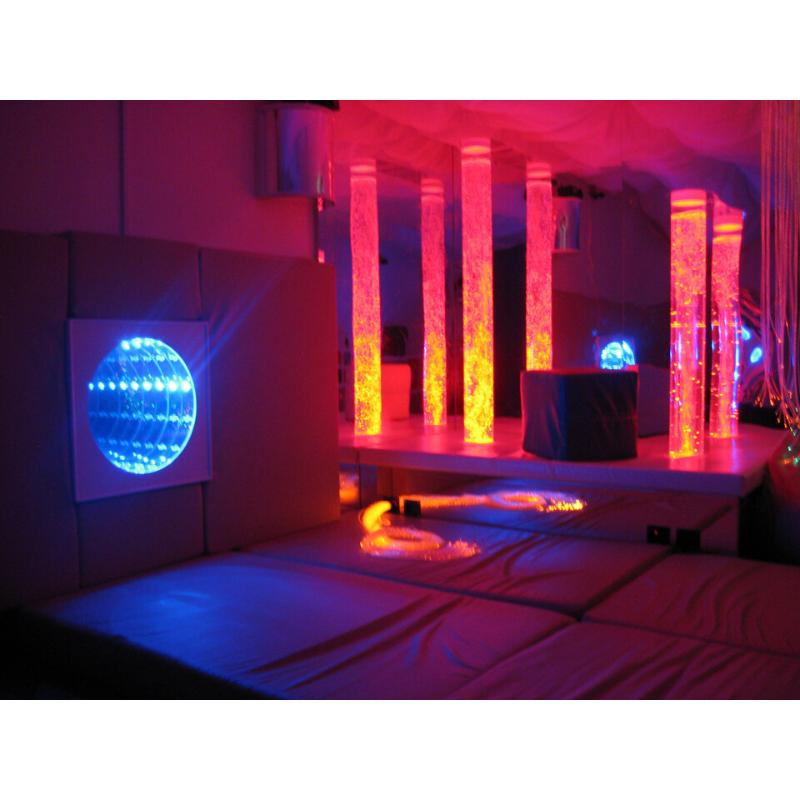 TFH Infinity Tunnel set up in a sensory room with bubble lights and bed