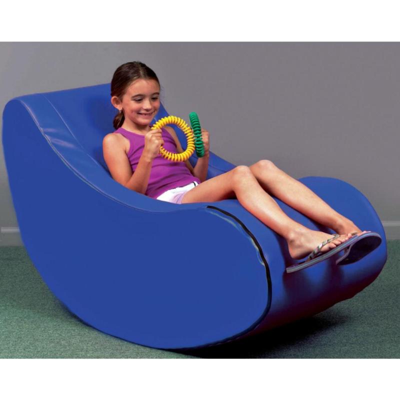 Girl in a blue TFH Jr Therapy Chair playing with colorful rings