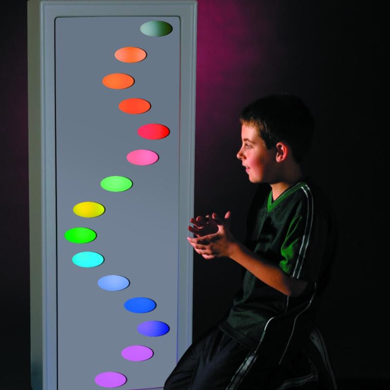Child sitting in front of the TFH Ladder Lights with Ladder mask showing various colorful wholes