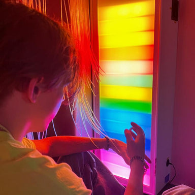Person interacting with  colorful TFH Ladder Lights