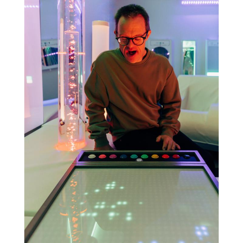 Person interacting with the TFH Pixels Pro Interactive Panel