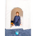 Child sitting inside a TFH Portable Sensory Den looking outside