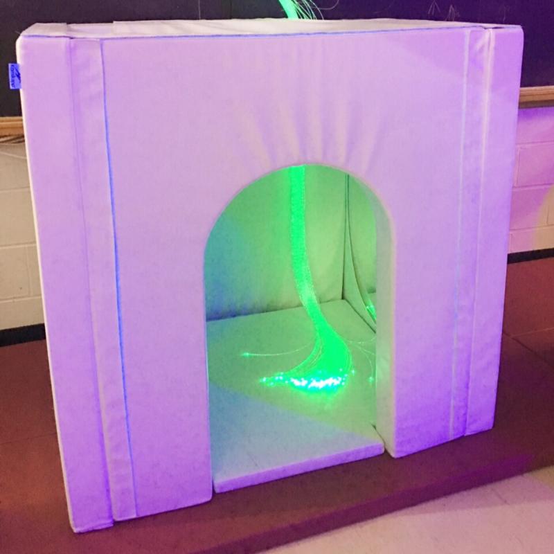 Full view of the TFH Portable Sensory Den with green lighting inside