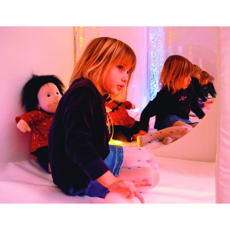 Mirrored image of a girl with a doll inside a TFH Portable Sensory Den