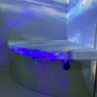 TFH Quadrant Podium Bench in a room with blue lighting