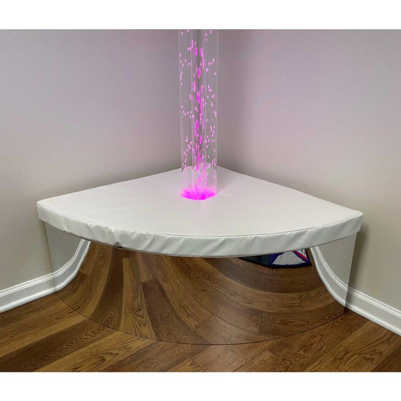 TFH Quadrant Tube Podium with a pink hurricane tube in a room with white walls and wooden floors