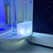 TFH Quadrant Tube Podium in a sensory room with bubble tube and Starfield carpet on the wall