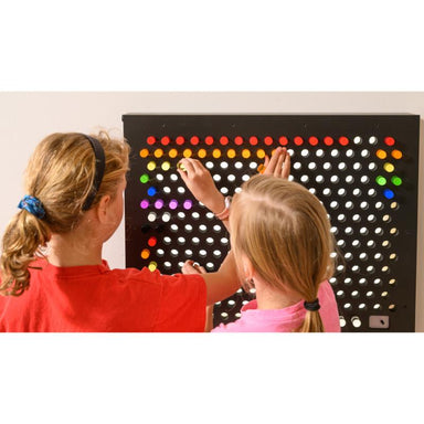Two children interacting with the TFH Rod Wall Light Panel 