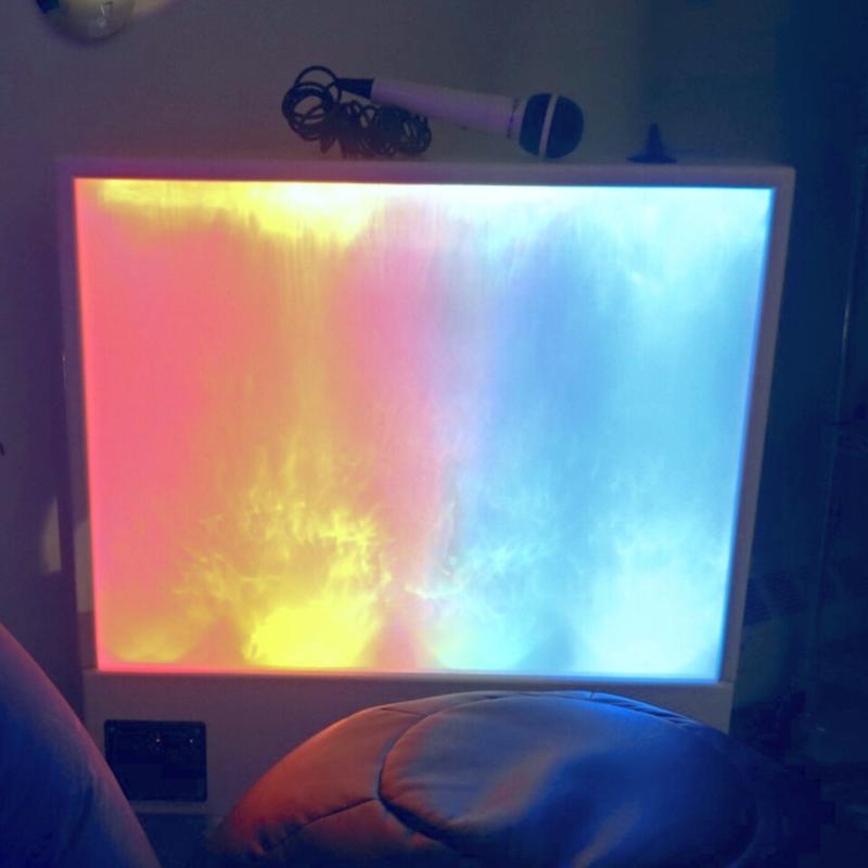 TFH Sound & Light Panel with a microphone on top in a dark sensory room
