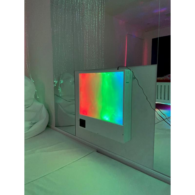 TFH Sound & Light Panel on a wall in a light sensory room with reflective surfaces