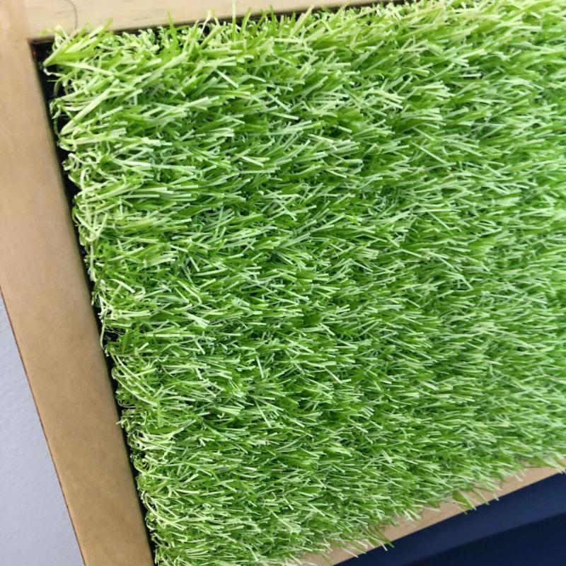 Close-up of the TFH  Tactile Columns with artificial green grass