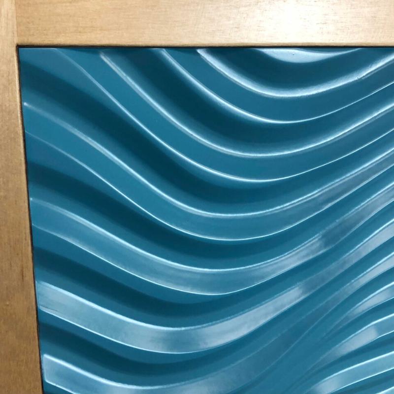 Close-up of the TFH  Tactile Columns with a textured blue wave