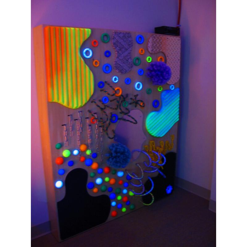 TFH UV Textured Wall with neon lights in a dark room