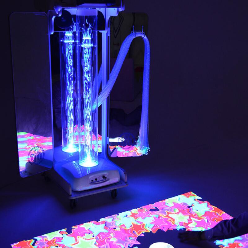 TFH Vecta Budii Mobile Sensory Station with blue lighting projecting colorful start to a dark floor