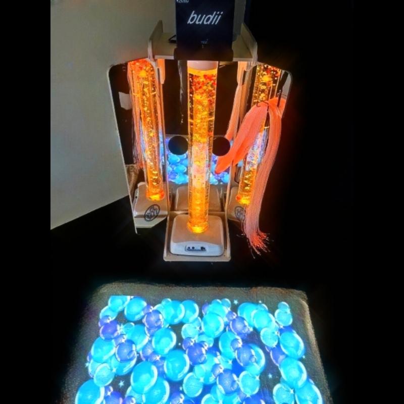 TFH Vecta Budii Mobile Sensory Station with orange lighting projecting blue bubbles on the floor