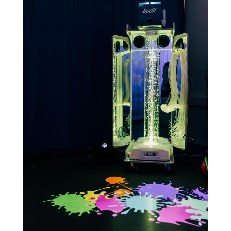 TFH Vecta Budii Mobile Sensory Station projecting paint splashes on a dark floor