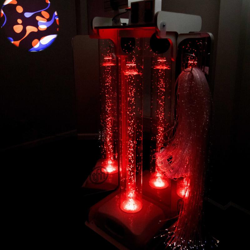 TFH Vecta Delight Mobile Sensory Station with red lighting and projector image on the wall in ark sensory room