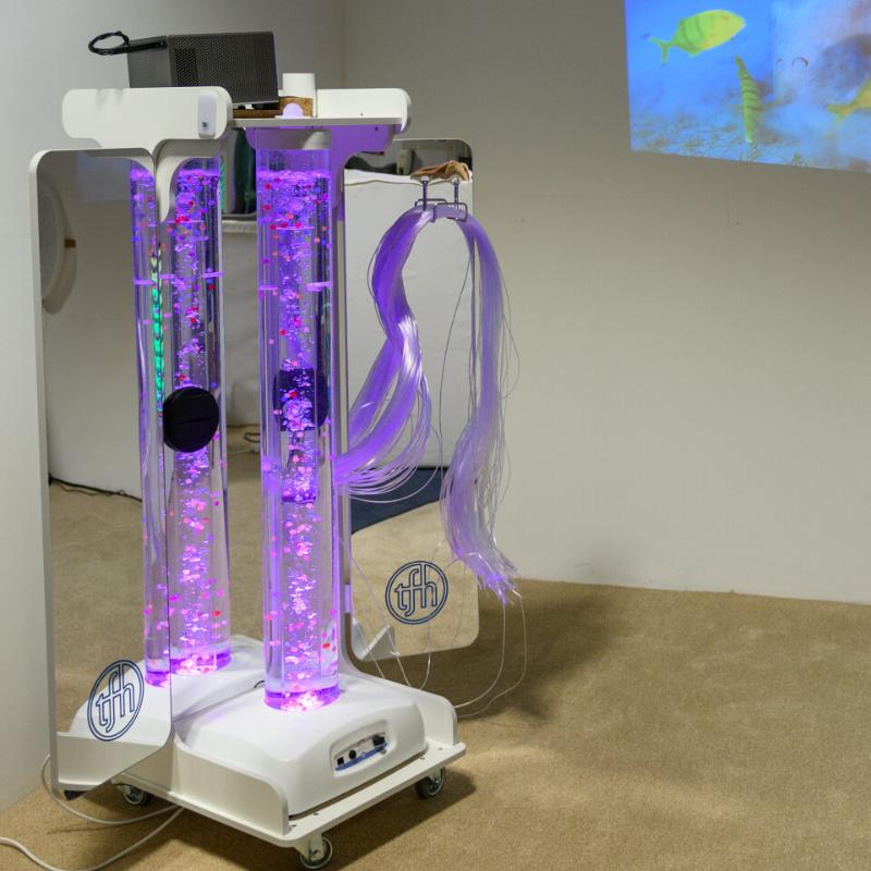 TFH Vecta Deluxe Mobile Sensory Station with purple light and fiber optic tails in a sensory room