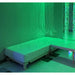 TFH Vibroacoustic Waterbed in a sensory room with green lighting