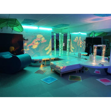 TFH Vibroacoustic Waterbed in a full sensory room  with relaxer chair, bubble tubes and wall projection