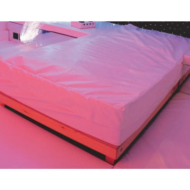 Closeup of the TFH Waterbed with Platform in room with pink lighting