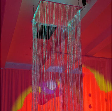TFH Wireless Controlled Fiber Optic Waterfall with red and yellow lighting in sensory room