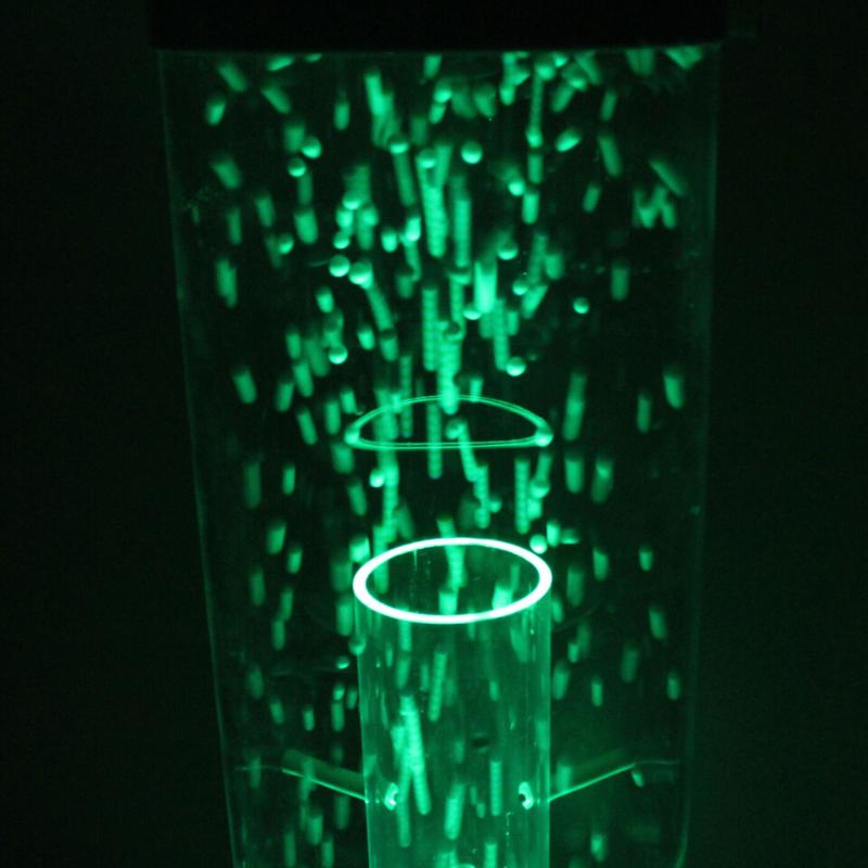 TFH Wireless Hurricane Tubes with green light in dark sensory room