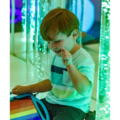 boy playing with TFH Genie Bubble Tubes